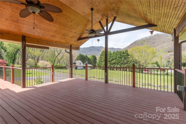 196 Timberline Dr, Maggie Valley, NC 28751 - wooden deck with a lawn, a ceiling fan, and a mountain view