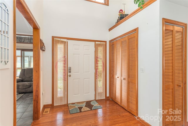 196 Timberline Dr, Maggie Valley, NC 28751 - entryway featuring a towering ceiling, light wood-style flooring, and baseboards