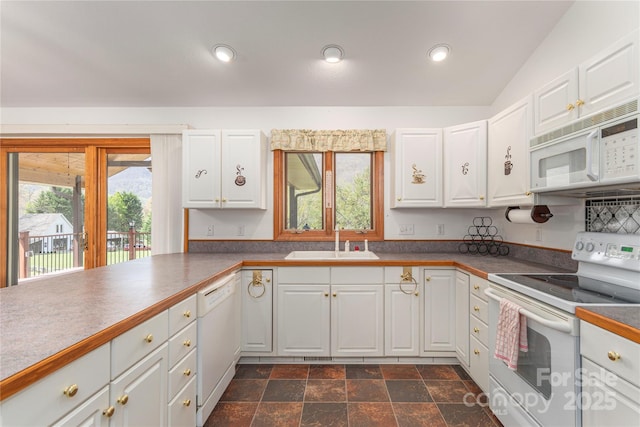 196 Timberline Dr, Maggie Valley, NC 28751 - kitchen featuring recessed lighting, a sink, stone finish flooring, white cabinetry, and white appliances