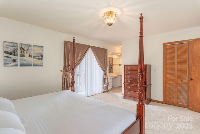 196 Timberline Dr, Maggie Valley, NC 28751 - bedroom featuring a closet, light carpet, and ensuite bathroom