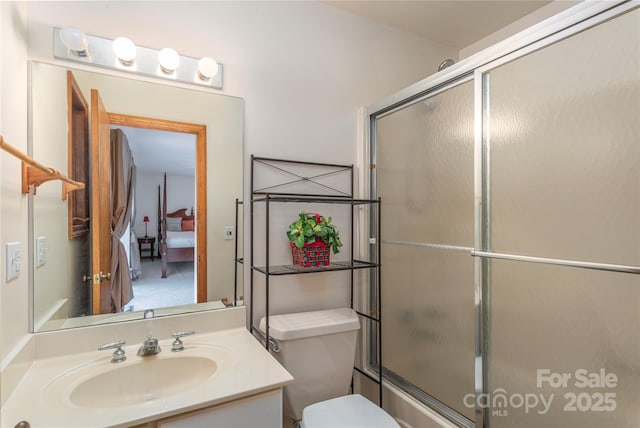 196 Timberline Dr, Maggie Valley, NC 28751 - bathroom featuring combined bath / shower with glass door, vanity, and toilet