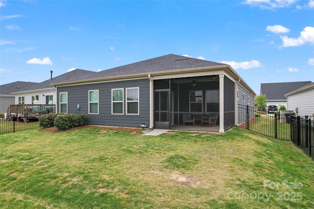 rear view of property with a sunroom and a deck