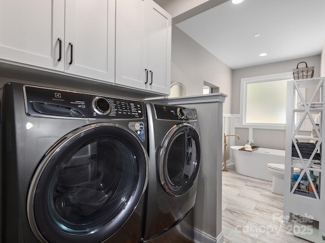 636 Crystal Heights Dr, Hendersonville, NC 28739 - laundry area featuring independent washer and dryer, wainscoting, cabinet space, a decorative wall, and recessed lighting