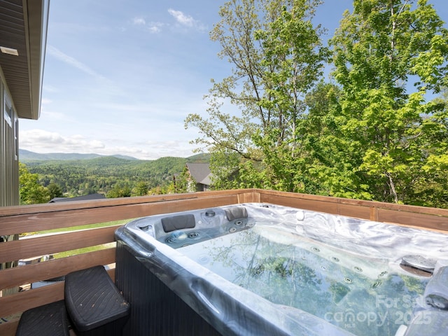 636 Crystal Heights Dr, Hendersonville, NC 28739 - wooden deck with a hot tub and a mountain view
