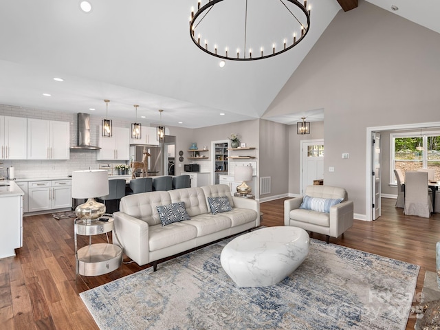 636 Crystal Heights Dr, Hendersonville, NC 28739 - living room with a chandelier, dark wood-style flooring, recessed lighting, high vaulted ceiling, and baseboards