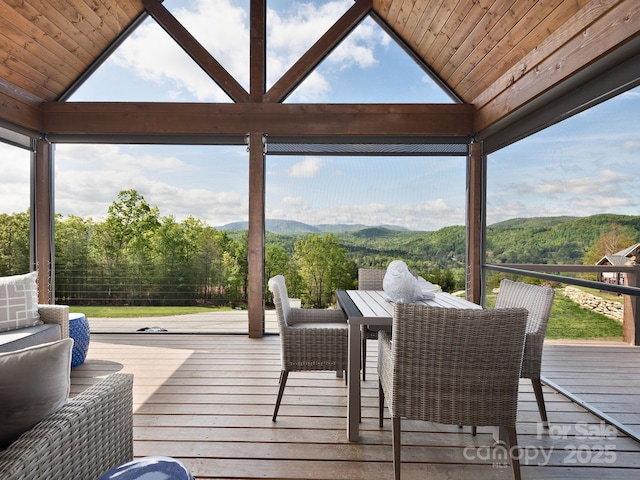 636 Crystal Heights Dr, Hendersonville, NC 28739 - wooden deck with outdoor dining area and a mountain view
