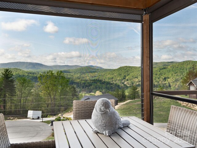 636 Crystal Heights Dr, Hendersonville, NC 28739 - wooden deck featuring a view of trees and a mountain view