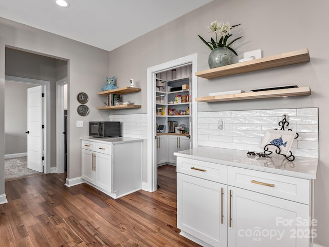 636 Crystal Heights Dr, Hendersonville, NC 28739 - kitchen featuring open shelves, black microwave, dark wood finished floors, white cabinets, and baseboards