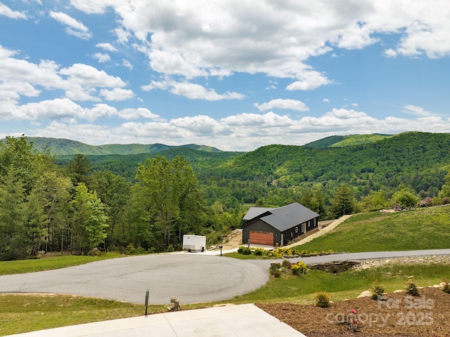 636 Crystal Heights Dr, Hendersonville, NC 28739 - view of mountain background featuring a heavily wooded area