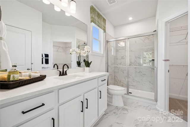 424 Balboa St, Matthews, NC 28104 - full bathroom with a walk in closet, vanity, a marble finish shower, and marble look tiles