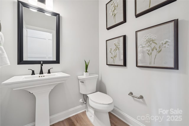 424 Balboa St, Matthews, NC 28104 - bathroom with baseboards and wood finished floors