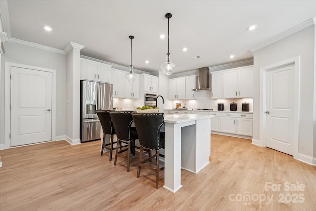 424 Balboa St, Matthews, NC 28104 - kitchen with stainless steel fridge, wall chimney exhaust hood, crown molding, black electric cooktop, and an island with sink