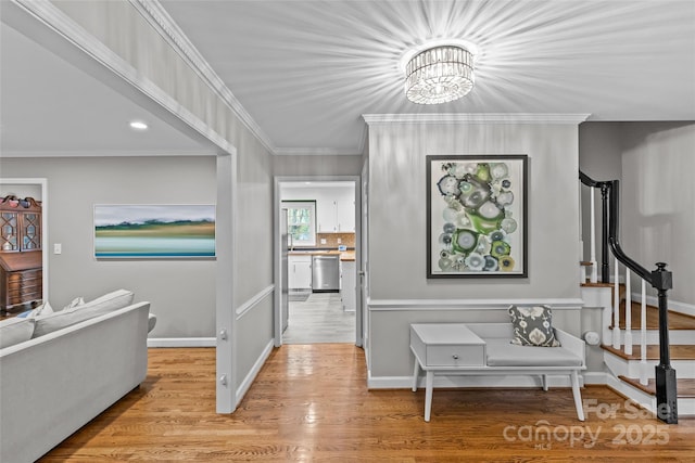 2418 Ainsdale Rd, Charlotte, NC 28226 - hall with a chandelier, ornamental molding, stairway, wood finished floors, and baseboards