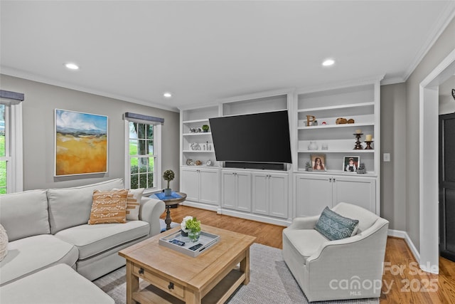2418 Ainsdale Rd, Charlotte, NC 28226 - living room with crown molding, light wood-style flooring, and recessed lighting