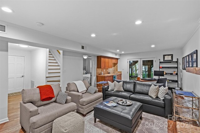 2418 Ainsdale Rd, Charlotte, NC 28226 - living area featuring recessed lighting, stairway, light wood-type flooring, bar, and baseboards