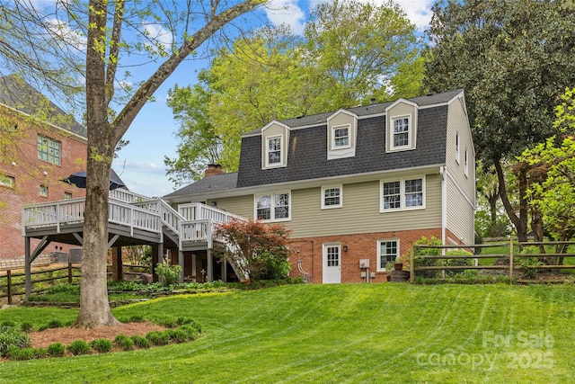 2418 Ainsdale Rd, Charlotte, NC 28226 - rear view of property with a wooden deck, brick siding, a gambrel roof, stairway, and roof with shingles