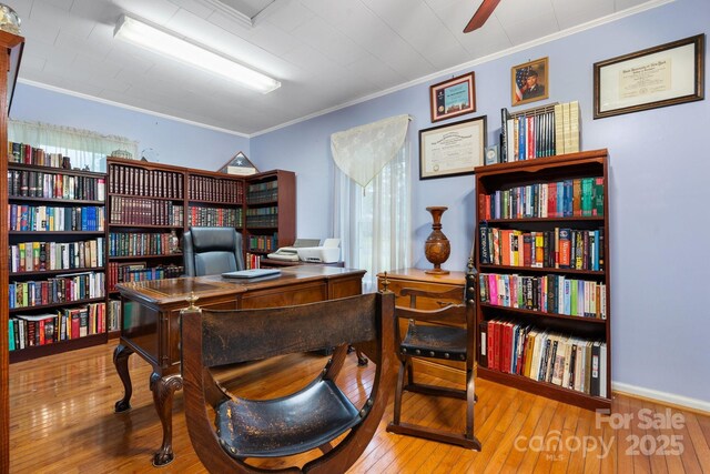 office space with ceiling fan, ornamental molding, and hardwood / wood-style flooring