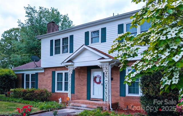 1287 Queensgate St, Gastonia, NC 28054 - view of front facade with a chimney and brick siding
