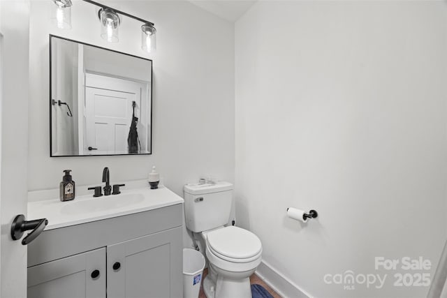 1009 Rainbow Cir, Catawba, SC 29704 - half bathroom with toilet, vanity, baseboards, and wood finished floors