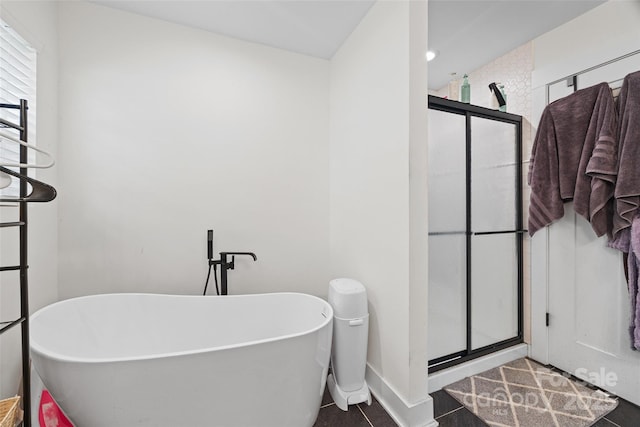 1009 Rainbow Cir, Catawba, SC 29704 - full bathroom with a shower stall, a soaking tub, baseboards, and tile patterned floors