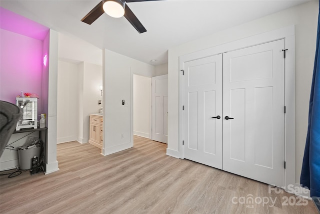1009 Rainbow Cir, Catawba, SC 29704 - bedroom with light wood-style floors, baseboards, a closet, and ceiling fan