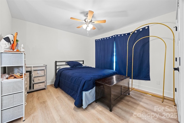 1009 Rainbow Cir, Catawba, SC 29704 - bedroom with wood finished floors, ceiling fan, and baseboards