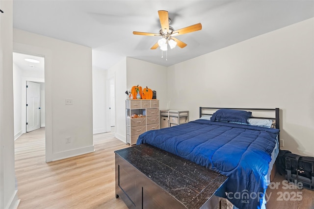 1009 Rainbow Cir, Catawba, SC 29704 - bedroom with light wood-style floors, baseboards, and ceiling fan