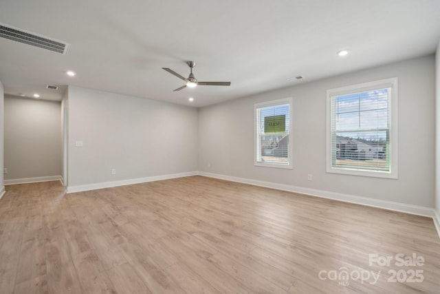 unfurnished room featuring a ceiling fan, light wood-type flooring, baseboards, visible vents, and recessed lighting