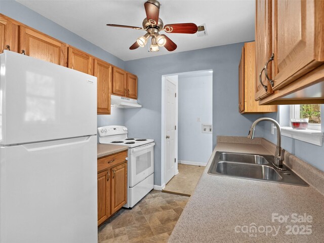 kitchen featuring a ceiling fan, white appliances, light countertops, under cabinet range hood, and a sink