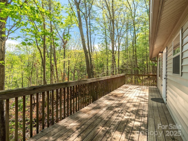 deck with a wooded view
