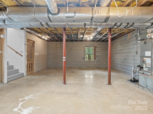 unfinished basement featuring stairs