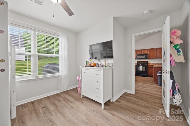 bedroom with visible vents, baseboards, ceiling fan, and light wood-style floors
