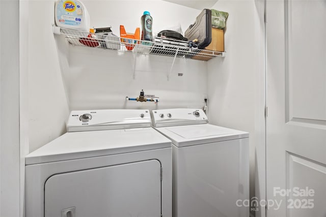 laundry area featuring washer and dryer and laundry area