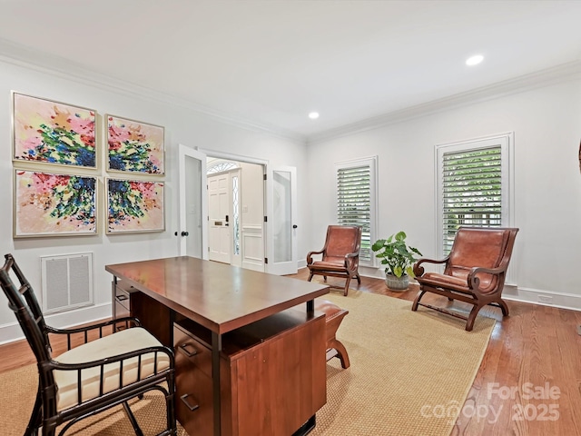 office with crown molding, recessed lighting, wood finished floors, and visible vents