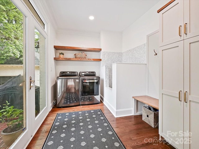 mudroom with ornamental molding, wood finished floors, baseboards, recessed lighting, and separate washer and dryer