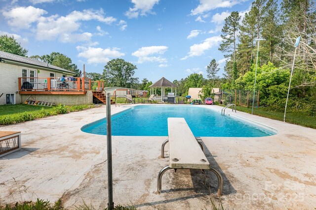 3603 Ken Mcentire Rd, Lawndale, NC 28090 - view of pool with a wooden deck, a patio, and a diving board