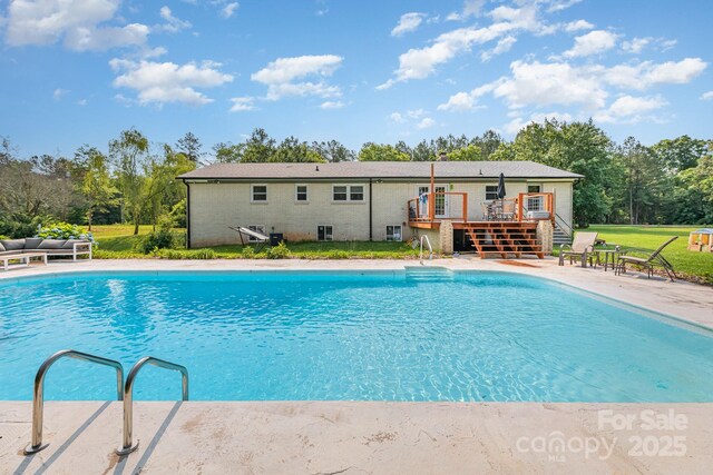 3603 Ken Mcentire Rd, Lawndale, NC 28090 - outdoor pool with a deck, stairway, a yard, and view of wooded area
