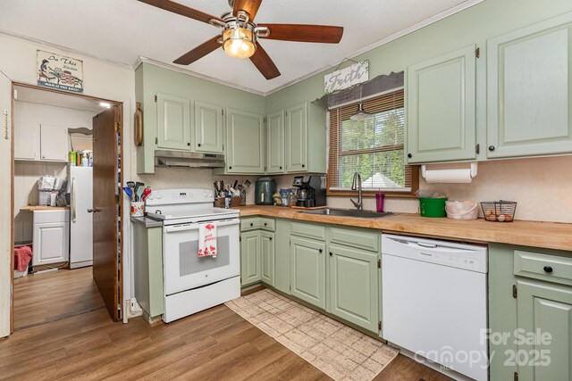 3603 Ken Mcentire Rd, Lawndale, NC 28090 - kitchen with white appliances, a sink, under cabinet range hood, crown molding, and light wood finished floors