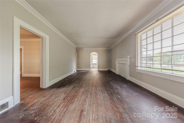 bonus room featuring arched walkways, dark wood finished floors, baseboards, visible vents, and a fireplace