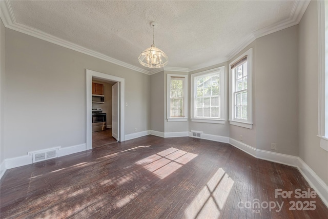 unfurnished dining area with an inviting chandelier, hardwood / wood-style floors, visible vents, and a textured ceiling