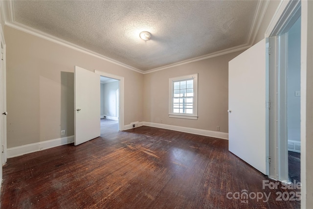 interior space with baseboards, crown molding, wood finished floors, and a textured ceiling
