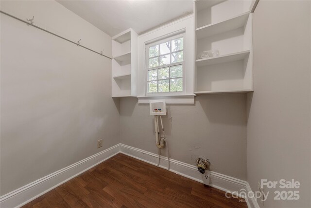 laundry room with dark wood-style floors, baseboards, hookup for a washing machine, and laundry area