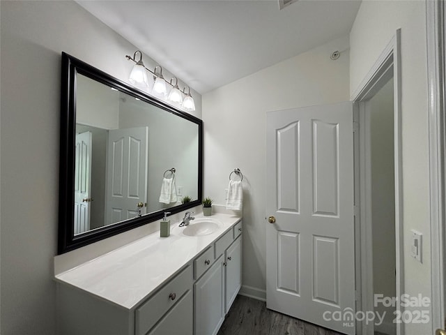 bathroom featuring vanity and wood finished floors