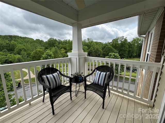 wooden terrace with a forest view