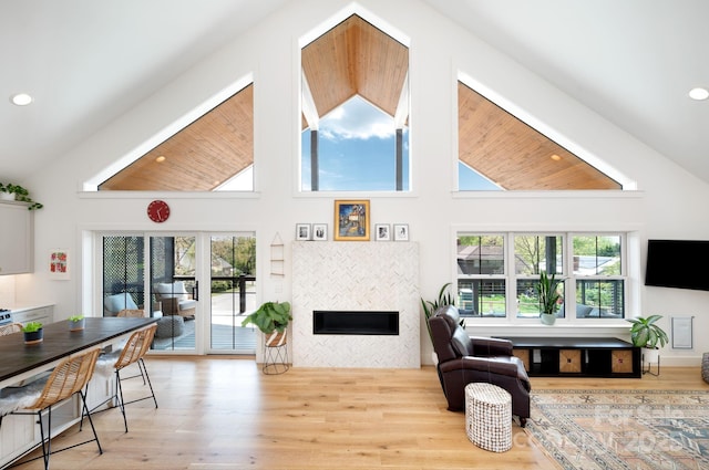 103 Pennsylvania Ave, Asheville, NC 28806 - living room with a tiled fireplace, high vaulted ceiling, wood finished floors, and recessed lighting