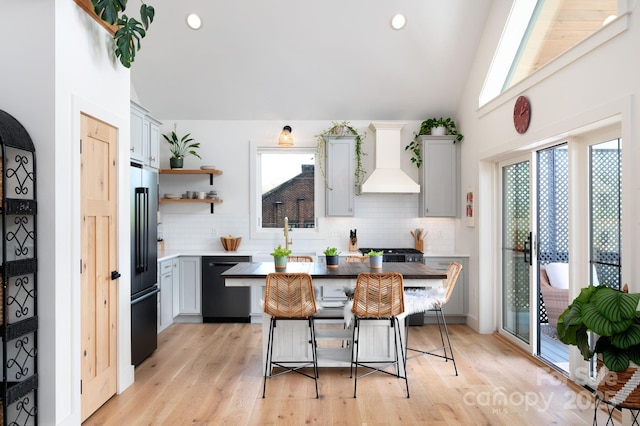 103 Pennsylvania Ave, Asheville, NC 28806 - kitchen featuring black appliances, plenty of natural light, backsplash, premium range hood, and lofted ceiling
