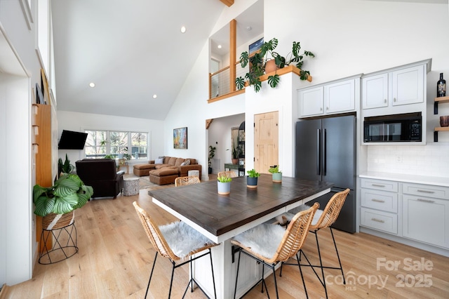 103 Pennsylvania Ave, Asheville, NC 28806 - dining space featuring high vaulted ceiling, light wood-style floors, and recessed lighting