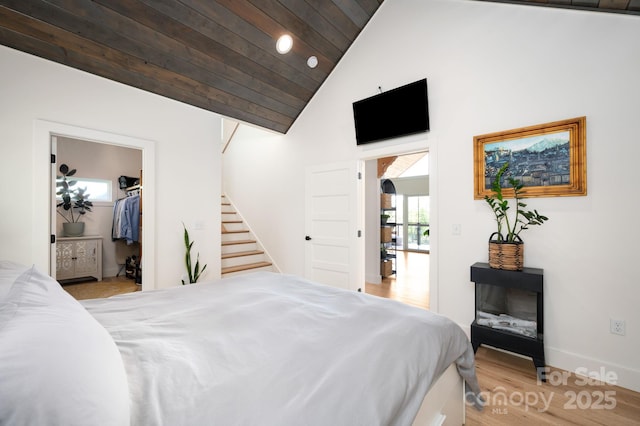 103 Pennsylvania Ave, Asheville, NC 28806 - bedroom with high vaulted ceiling, wood ceiling, wood finished floors, baseboards, and a walk in closet