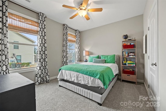 bedroom featuring a ceiling fan, baseboards, and carpet floors