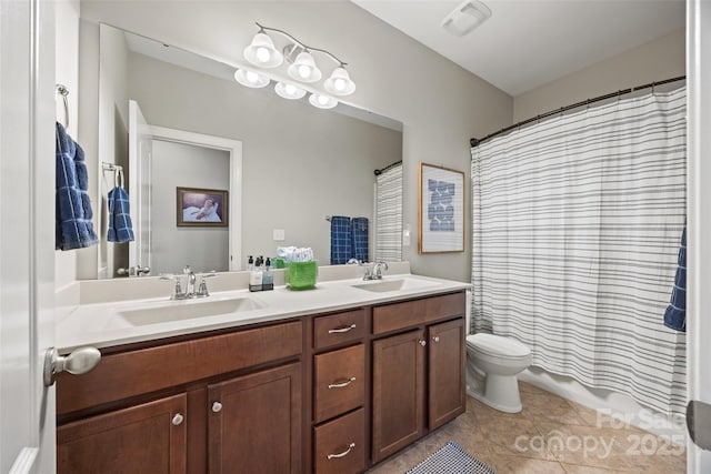 full bathroom with toilet, tile patterned floors, a sink, and double vanity